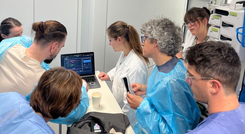 Clinical team reviewing Deep Breath data on a laptop in a hospital setting